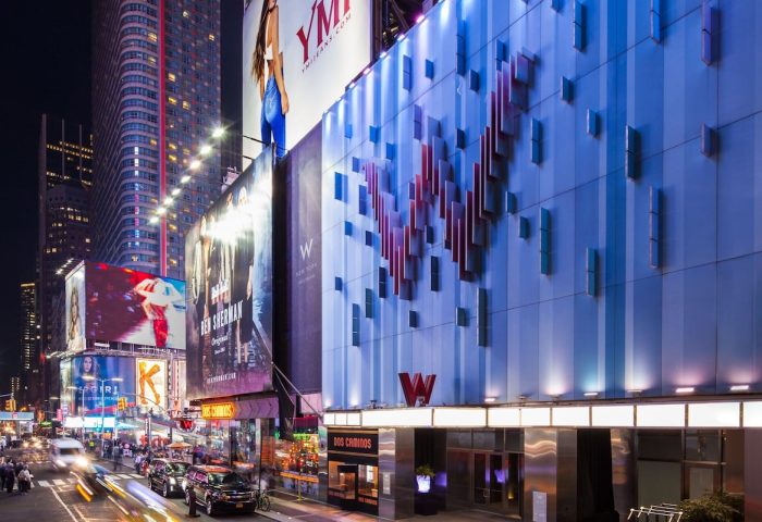 W New York - Times Square Hotel facade at night. Gay-friendly hotel in NYC with modern design and vibrant city views.