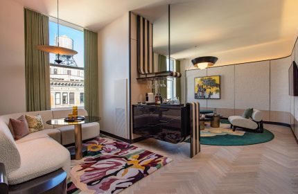W New York Union Square gay-friendly hotel room. Modern design, sitting area, bar, city view. Upscale gay travel in NYC.