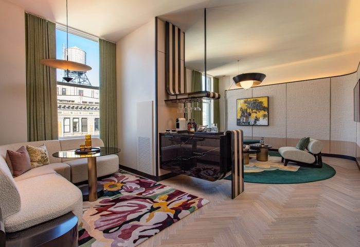 W New York Union Square gay-friendly hotel room. Modern design, sitting area, bar, city view. Upscale gay travel in NYC.