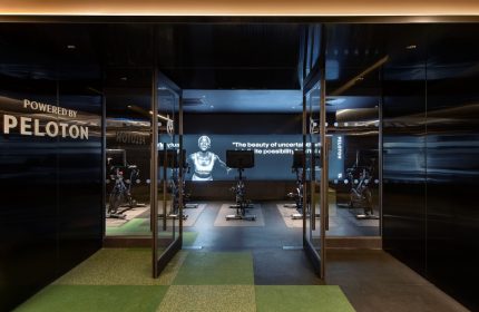 W New York Union Square gay-friendly hotel Peloton gym. Fitness center at this upscale hotel. Exercise bikes and motivational screen.