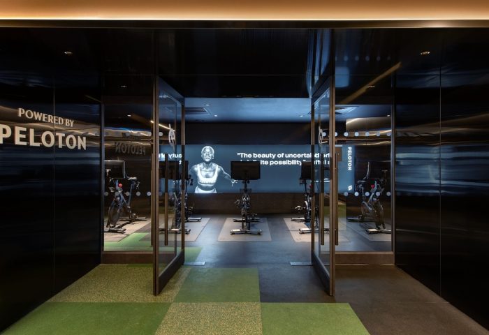 W New York Union Square gay-friendly hotel Peloton gym. Fitness center at this upscale hotel. Exercise bikes and motivational screen.