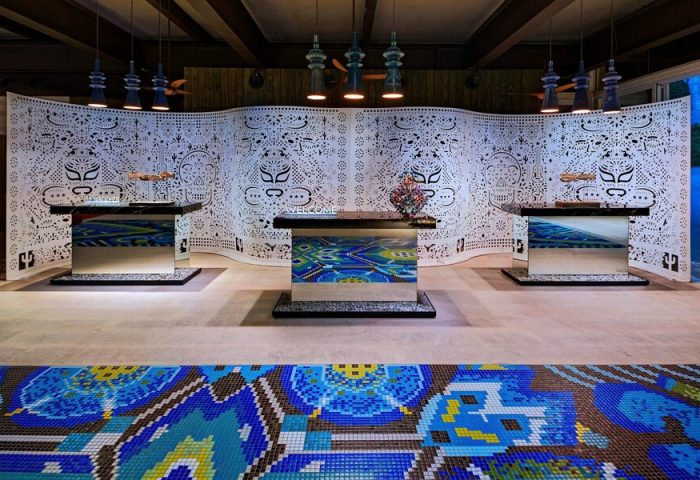 W Punta de Mita's chic lobby. This gay-friendly hotel boasts stylish decor, including mosaic floors, patterned screens, and mirrored desks.