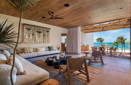 W Punta de Mita gay-friendly hotel suite. Open-air living room with ocean view, stylish decor, and comfortable seating. Perfect for gay travel.