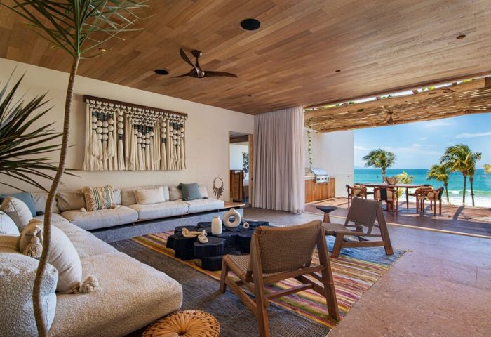 W Punta de Mita gay-friendly hotel suite. Open-air living room with ocean view, stylish decor, and comfortable seating. Perfect for gay travel.