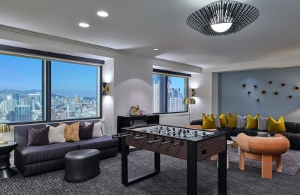 W San Francisco, a gay-friendly hotel. Room with foosball table, city views, and modern decor. Ideal for gay men's travel in San Francisco.