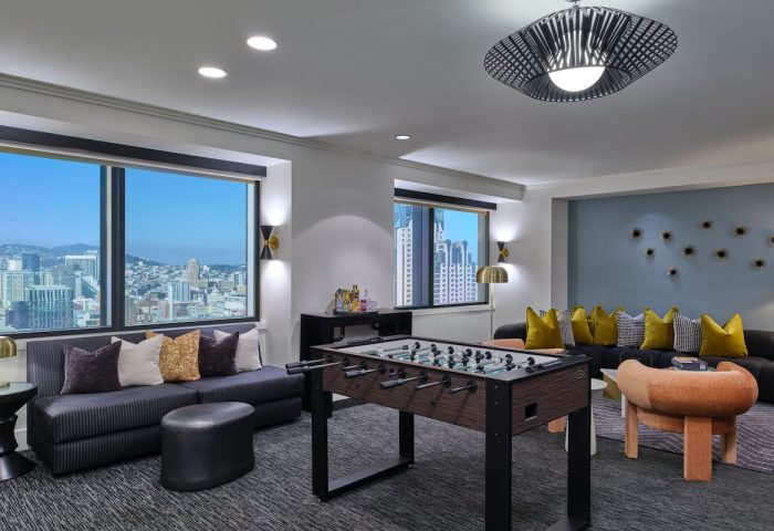W San Francisco, a gay-friendly hotel. Room with foosball table, city views, and modern decor. Ideal for gay men's travel in San Francisco.