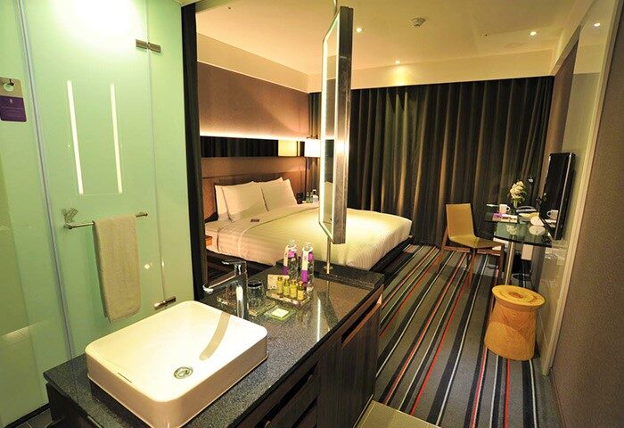 WESTGATE Hotel room. Modern gay-friendly hotel with bed, desk, and bathroom. Upscale amenities for gay men travel. Stylish design, comfortable stay.