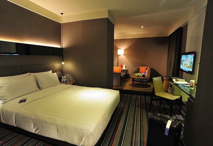 WESTGATE Hotel room. Gay-friendly hotel with bed, sitting area, desk, and TV. Modern design, comfortable for gay travelers.