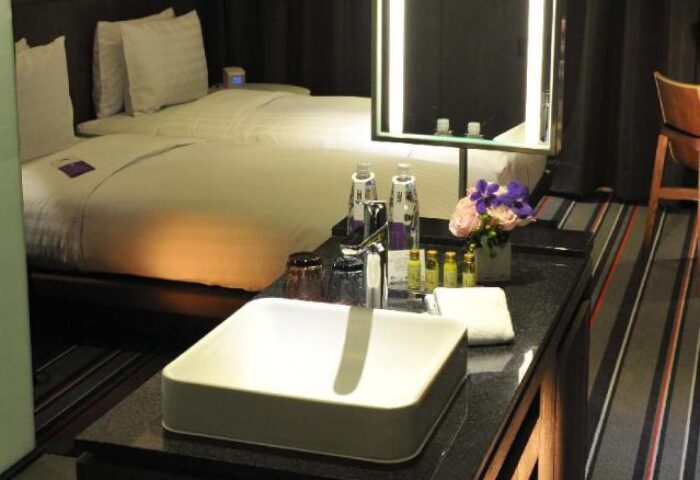 WESTGATE Hotel gay-friendly room. Double beds, sink, mirror, and toiletries. Upscale accommodations for gay travelers. Modern design.