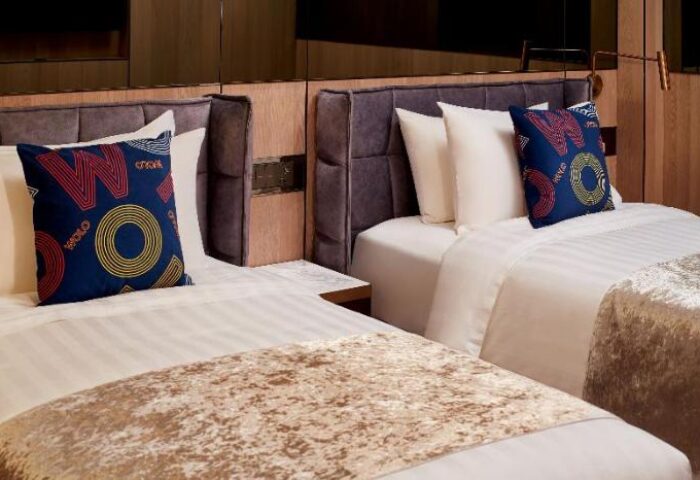 WOLO Kuala Lumpur hotel room. Two beds with decorative pillows. Gay-friendly hotel in Kuala Lumpur for gay men travelers.