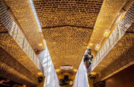 Interior of Wasserturm Hotel Cologne, a gay-friendly Curio Collection by Hilton. Unique brickwork design and modern lighting.