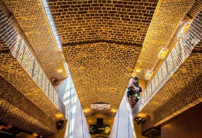 Interior of Wasserturm Hotel Cologne, a gay-friendly Curio Collection by Hilton. Unique brickwork design and modern lighting.