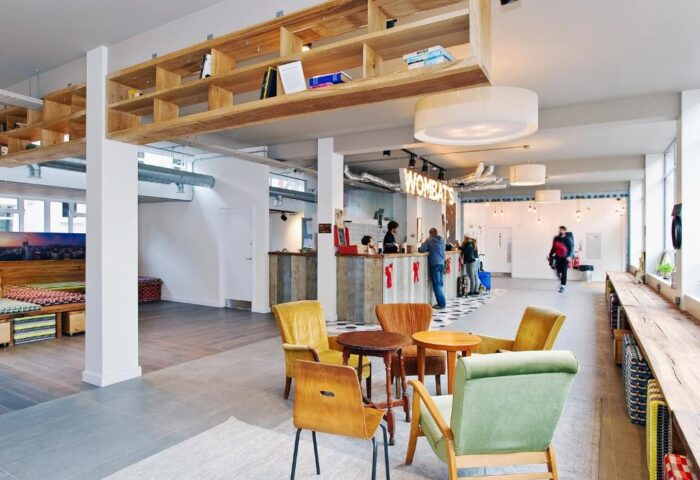 Wombats City Hostel London lobby area. Gay-friendly hotel with reception, seating, and modern design. A welcoming space for LGBTQ+ travelers.