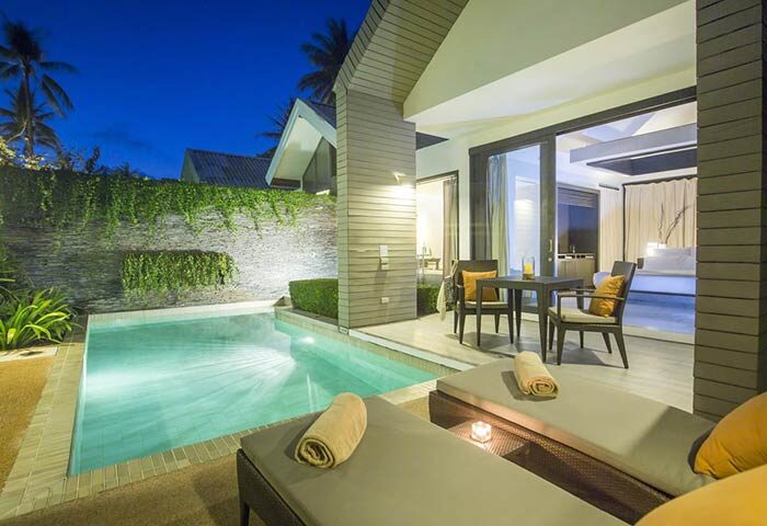 X2 Koh Samui, a gay-friendly spa retreat. Private pool villa with sun loungers, outdoor dining, and bedroom view. Relaxing gay travel.
