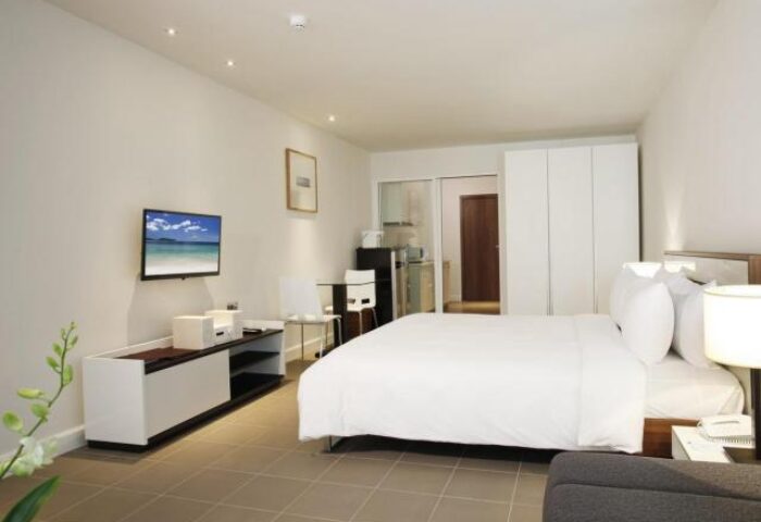 X2 Vibe Phuket Patong gay-friendly hotel room. Modern design, white linens, TV, kitchenette. Perfect for gay travelers seeking style and comfort.
