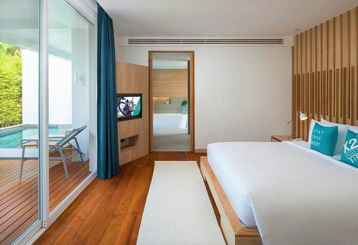 X2 Vibe Phuket Patong gay-friendly hotel room. Modern design, pool access, comfy bed. Ideal for gay travel in Phuket, Thailand. Stylish & relaxing.