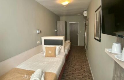 XO Hotels City Centre room. Twin beds, TV, and desk. Gay-friendly hotel offering comfortable accommodations in a central location.