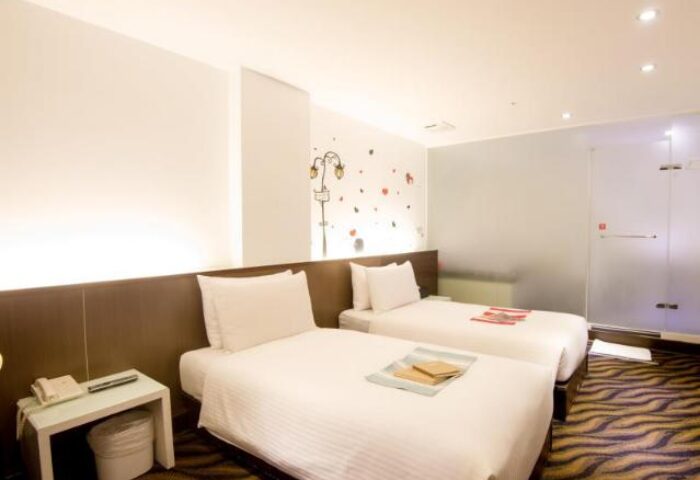 Ximen Holiday Fun Hotel room with two beds. Gay-friendly hotel in Ximen, Taipei. Modern design, clean and comfortable. Great for gay travelers.
