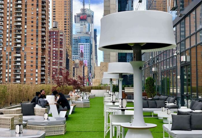 YOTEL New York Times Square rooftop lounge. Gay-friendly hotel with outdoor seating, city views, and modern design. Perfect for gay travelers.