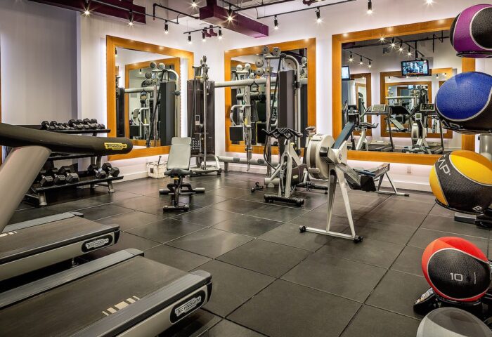 YOTEL New York Times Square gym. Gay-friendly hotel fitness center with treadmills, weights, and mirrored walls. Workout while traveling!
