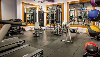 YOTEL New York Times Square gym. Gay-friendly hotel fitness center with treadmills, weights, and mirrored walls. Workout while traveling!