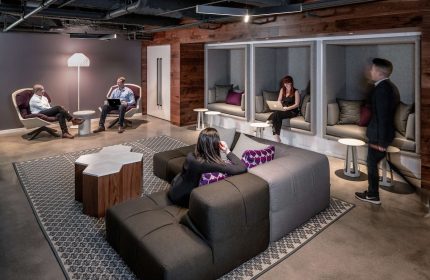 YOTEL San Francisco's stylish lounge area. A gay-friendly hotel with modern design, work spaces, and comfortable seating.