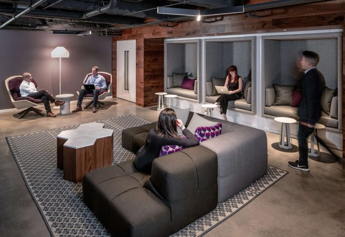 YOTEL San Francisco's stylish lounge area. A gay-friendly hotel with modern design, work spaces, and comfortable seating.