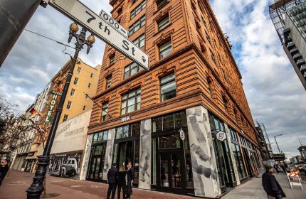 Exterior of YOTEL San Francisco, a gay-friendly hotel, at 7th St. Modern design meets historic brick. Great location for gay travelers.