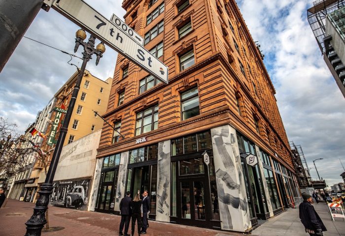 Exterior of YOTEL San Francisco, a gay-friendly hotel, at 7th St. Modern design meets historic brick. Great location for gay travelers.
