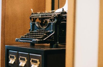 Yangon Excelsior gay-friendly hotel: Vintage typewriter atop a cabinet, evoking a sense of history and charm for gay travelers.