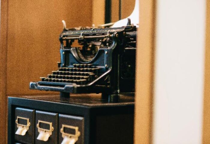 Yangon Excelsior gay-friendly hotel: Vintage typewriter atop a cabinet, evoking a sense of history and charm for gay travelers.