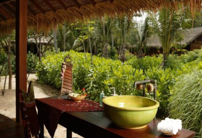 Zeavola Hotel's gay-friendly charm: Outdoor bathroom with lush greenery. Perfect for gay men seeking a relaxing, tropical getaway.