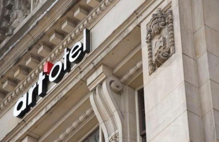 Art'otel Amsterdam facade. Gay-friendly hotel with architectural details and signage. A top hotel choice for gay travelers in Amsterdam.