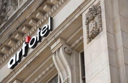 Art'otel Amsterdam facade. Gay-friendly hotel with architectural details and signage. A top hotel choice for gay travelers in Amsterdam.