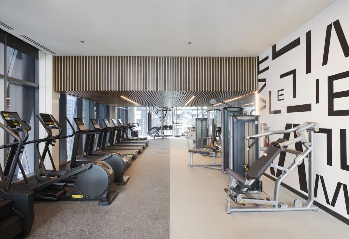 citizenM Chicago Downtown gay-friendly hotel gym. Treadmills, elliptical machines, and weight machines. Modern design, fitness center.