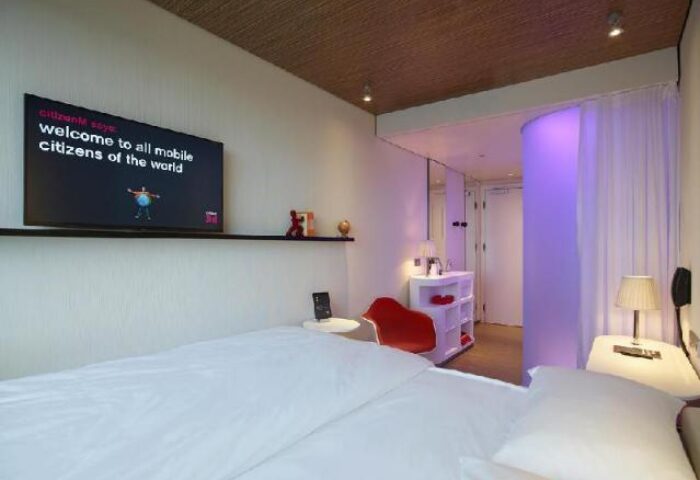 citizenM Kuala Lumpur Bukit Bintang hotel room. Modern design, TV, and comfortable bed. A gay-friendly hotel in Kuala Lumpur.
