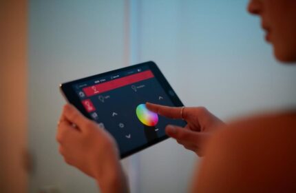 citizenM London Bankside: Guest using tablet to control room settings. Gay-friendly hotel offers modern tech for a comfortable stay.