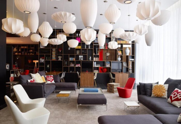 citizenM London Bankside hotel lobby with modern design. Gay-friendly hotel with stylish furniture and lighting. Perfect for gay travel.