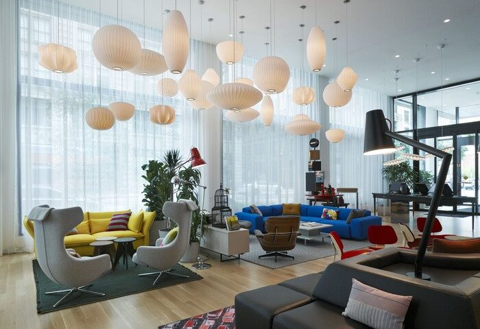 citizenM Los Angeles Downtown lobby. Modern, gay-friendly hotel with colorful seating, unique lighting, and stylish design elements.
