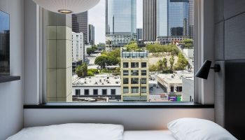 citizenM Los Angeles Downtown gay-friendly hotel room view. Modern design, skyline view, comfortable bed. Great for gay travelers.