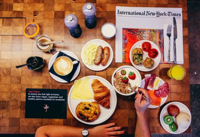 citizenM Los Angeles Downtown gay-friendly hotel breakfast. Diverse food options including vegan, vegetarian, pastries, fruit, and coffee.