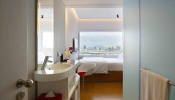 citizenM Taipei North Gate hotel room. Modern design, city view. Gay-friendly accommodation in Taipei for LGBTQ+ travelers.