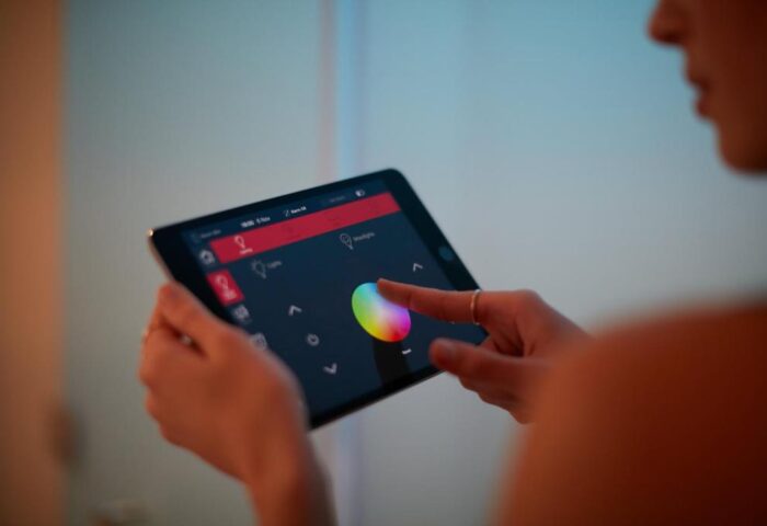 Tablet controlling room lighting at citizenM Tower of London, a gay-friendly hotel. Modern tech for a comfortable, personalized stay.