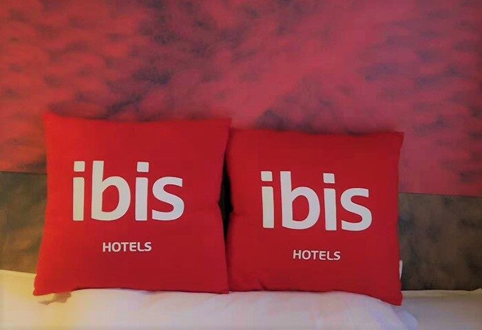 Ibis Beijing Tuanjiehu hotel pillows. Gay-friendly hotel in Beijing, China. Comfortable stay for gay travelers. Ibis Hotels logo.