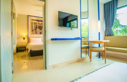 Holiday Inn Express Krabi Ao Nang Beach hotel room. Modern design, TV, desk, and view. Ideal for a gay honeymoon in Krabi, Thailand.