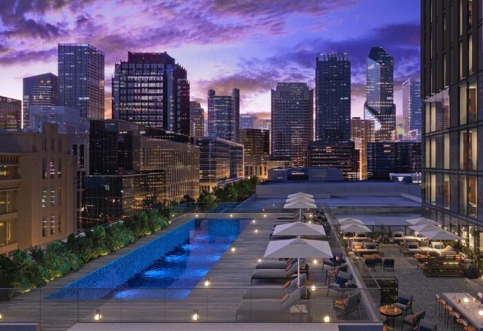 Le Meridien Melbourne gay hotel rooftop pool view. Melbourne skyline at dusk. Gay travel accommodations and luxury hotel experience.