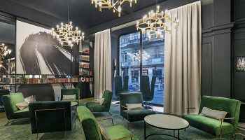 Hotel Century Old Town Prague-MGallery lobby. Green velvet chairs, modern chandeliers. Gay-friendly hotel near Prague's gay bars/saunas.