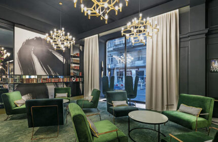 Hotel Century Old Town Prague-MGallery lobby. Green velvet chairs, modern chandeliers. Gay-friendly hotel near Prague's gay bars/saunas.