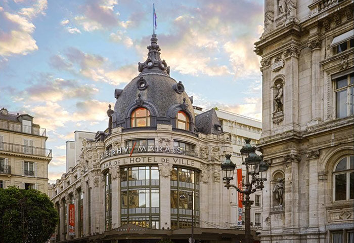 Hotel Turenne Le Marais, a gay-popular hotel in Paris city center. Building's facade with ornate details, architecture, and Parisian charm.