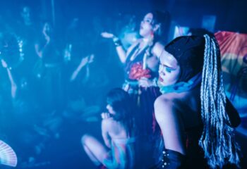 GenderFunk Ho Chi Minh City: Queer party scene with drag performers, blue lighting, and a rainbow flag. Gay travel in Vietnam.